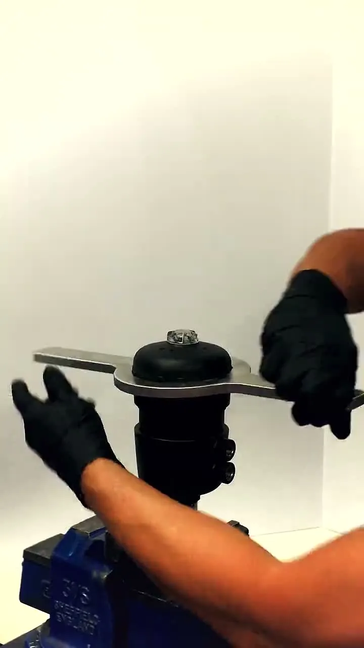 A pneumatic actuator being fitted to a diaphragm valve body held in a bench vise