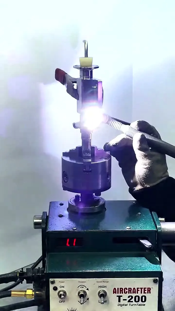 A hand TIG weld running on a valve body turned in a rotary weld positioner